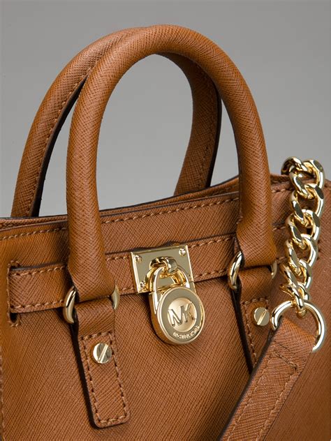 michael kors multifunction tote brown|Michael Kors brown shoulder bag.